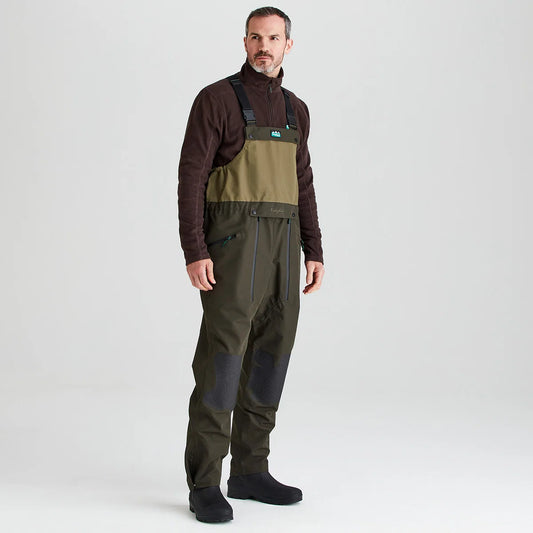 Ridgeline Men's Agri Pro Bib and Brace in action with adjustable braces and reinforced knee patches.