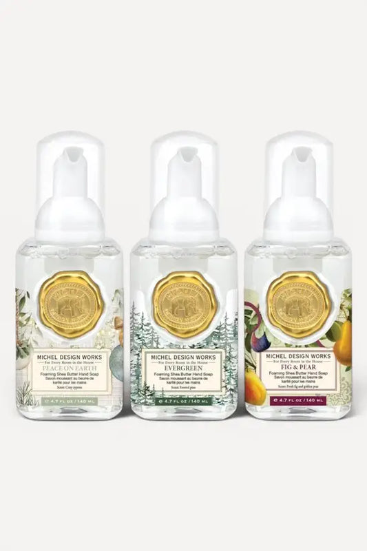 Michel Design Works seasonal trio of mini foaming hand soaps featuring Peace on Earth, Evergreen, and Fig and Pear bottles