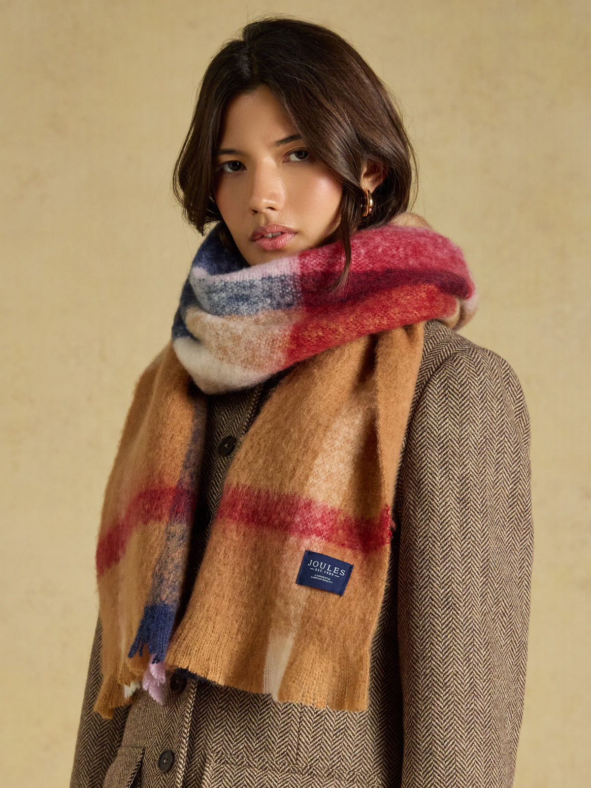 Joules Betsy brushed oversized scarf in a tan brown check with traditional twisted tassel edges.