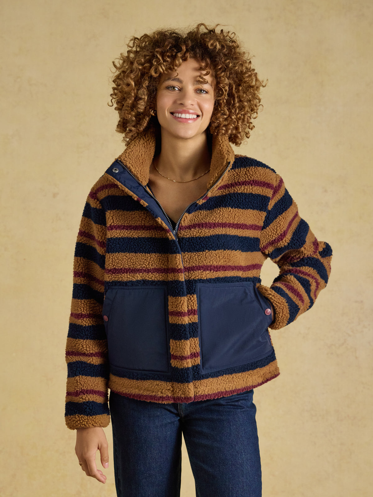 Joules Womens Lottie Borg Fleece Jacket in textured borg fabric with funnel neck and contrast woven patch pockets.