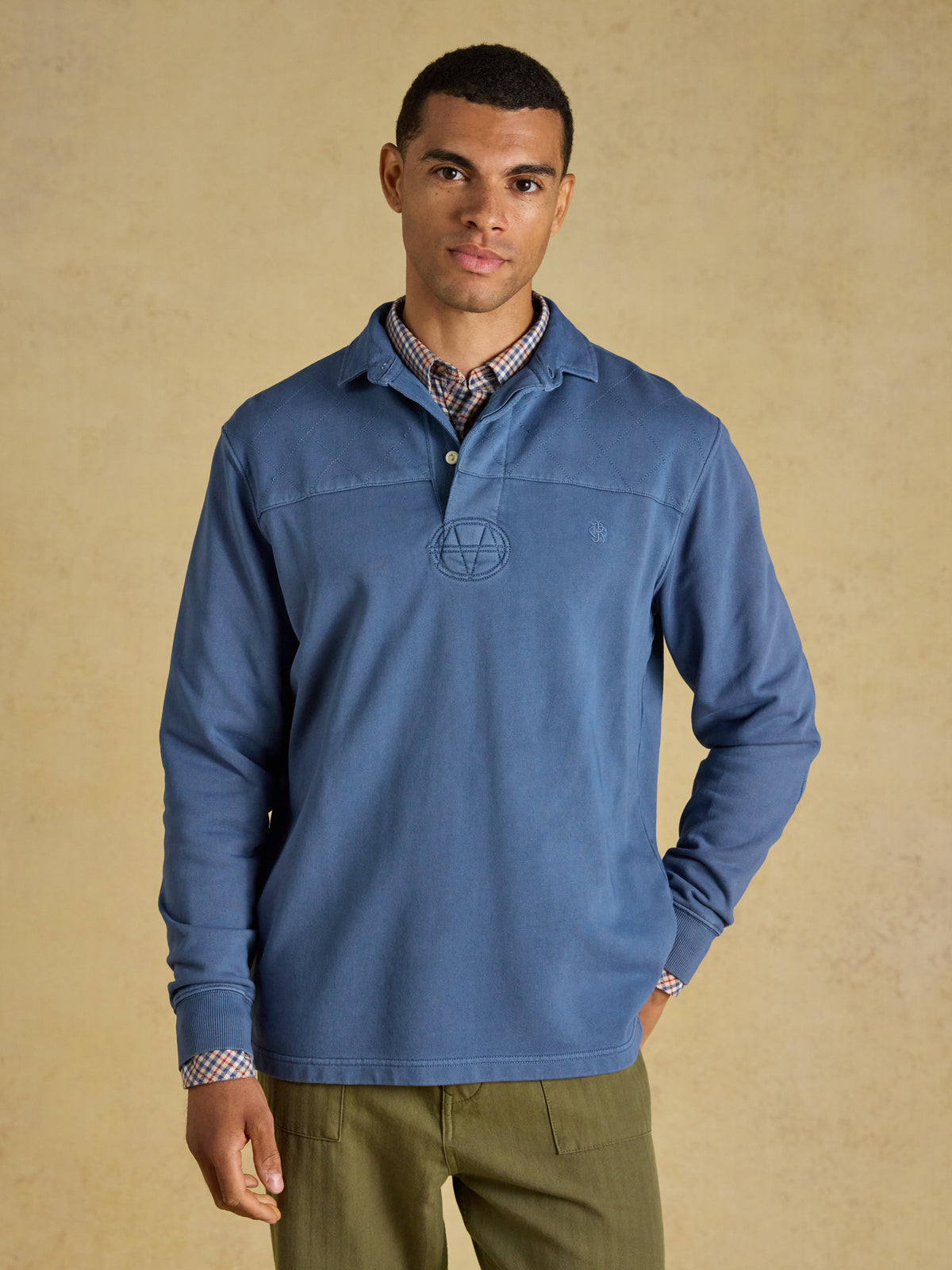 Joules garment dyed loopback cotton rugby shirt with twill collar and long sleeves.