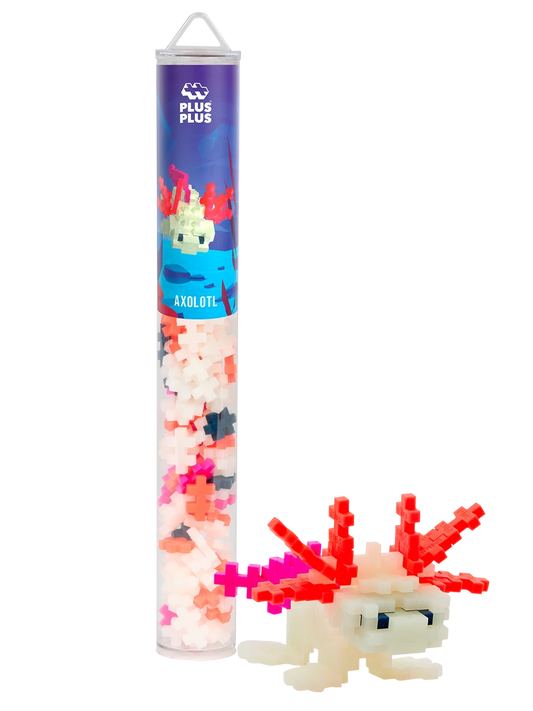 Plus-Plus Axolotl tube packaging alongside a constructed glow-in-the-dark axolotl figure made from interlocking pieces.