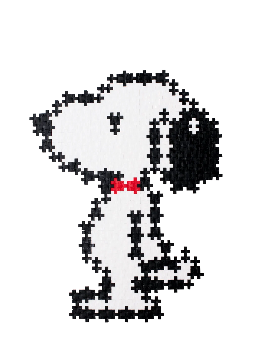 Plus-Plus Snoopy Puzzle by Number tube packaging beside a completed black and white Snoopy figure with a red collar.