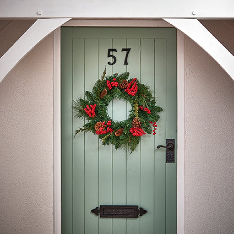Premier 50cm Cone and Berry PVC Christmas Wreath with red berries and pine cones.