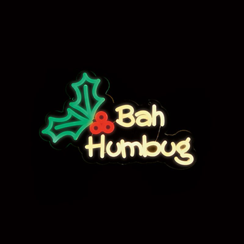 Premier 36cm Lit Bah Humbug neon hanging sign glowing with green holly leaves and yellow lettering.
