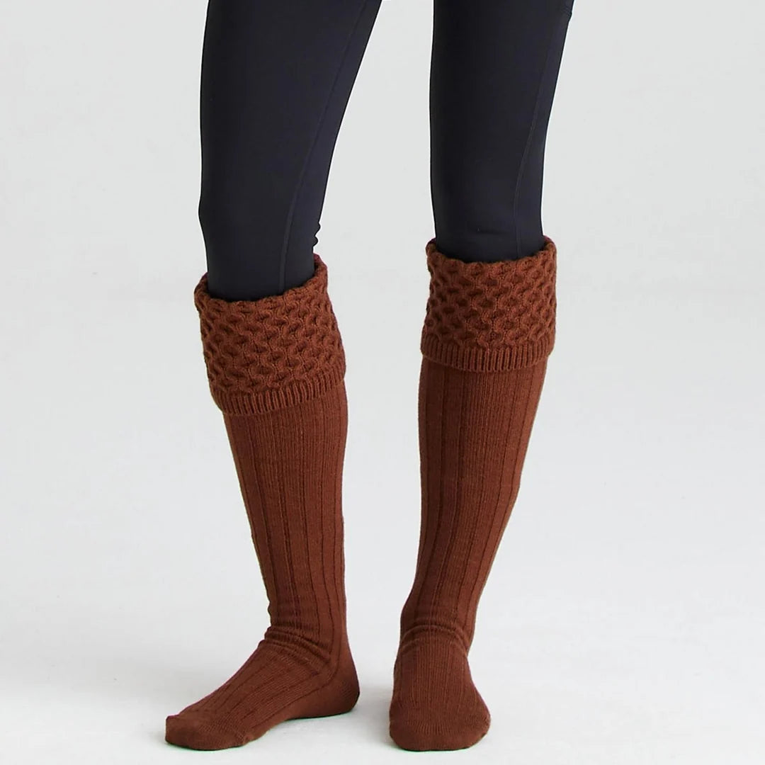 Pair of Ridgeline double cuff welly socks in knitted acrylic worn folded over black wellington boots