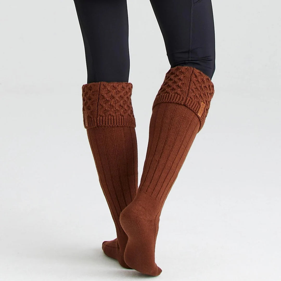 Pair of Ridgeline double cuff welly socks in knitted acrylic worn folded over black wellington boots