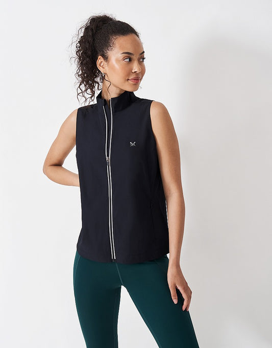 Crew Clothing running performance gilet with ripstop panels, hidden zip pockets, and reflective crossed oars chest print