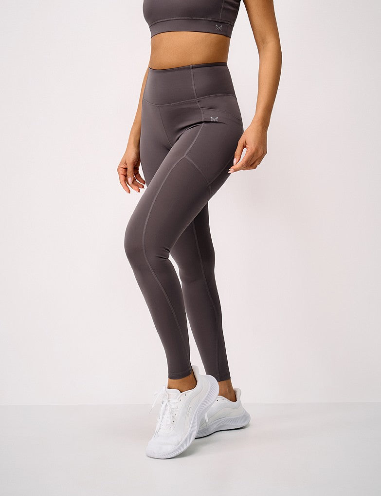 Women's full length dark brown gloss jersey leggings with a phone pocket and silver printed crossed oars on the thigh.