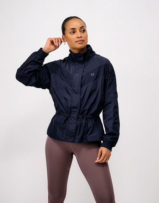 Crew Clothing Hooded Windbreaker Jacket featuring a breathable mesh lining, removable hood, adjustable drawcord waist, and silver reflective crossed oars on the chest.