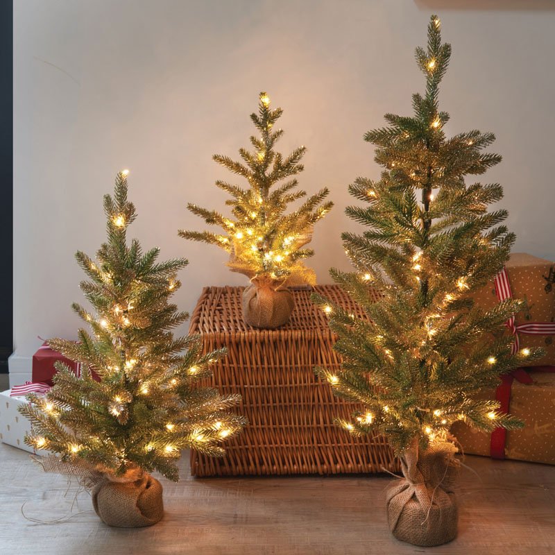 Smart Garden InLit Sparkly Fir 85cm pre-lit artificial Christmas tree with warm white lights wrapped in a hessian base.