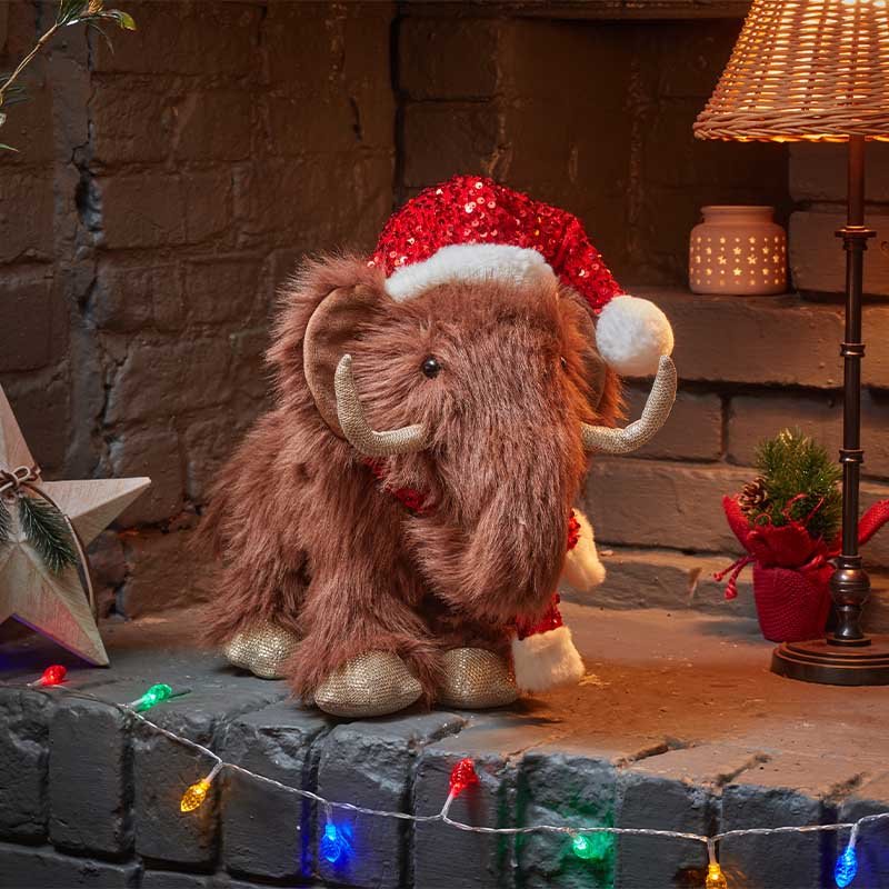 Bring festive fun home with the large Smart Garden Merry Mammoth plush decoration. Features soft fluffy fabric and sequin accents.