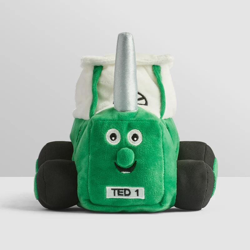 Soft green Tractor Ted plush toy sitting upright with embroidered details