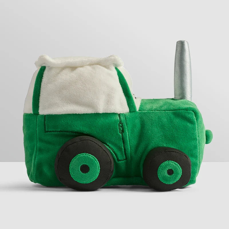 Soft green Tractor Ted plush toy sitting upright with embroidered details