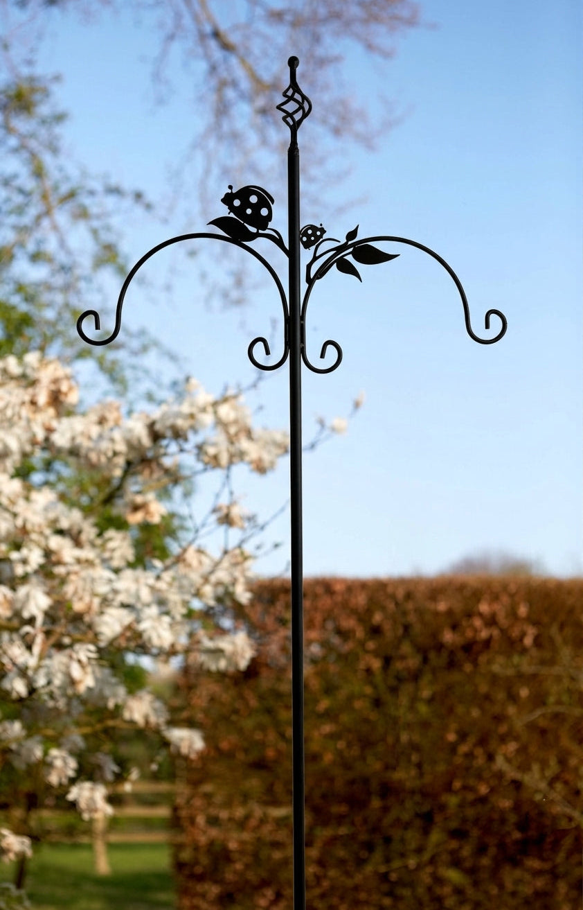 Tom Chambers Gala Bird Feeding Station with ladybird bracket details against a garden backdrop.