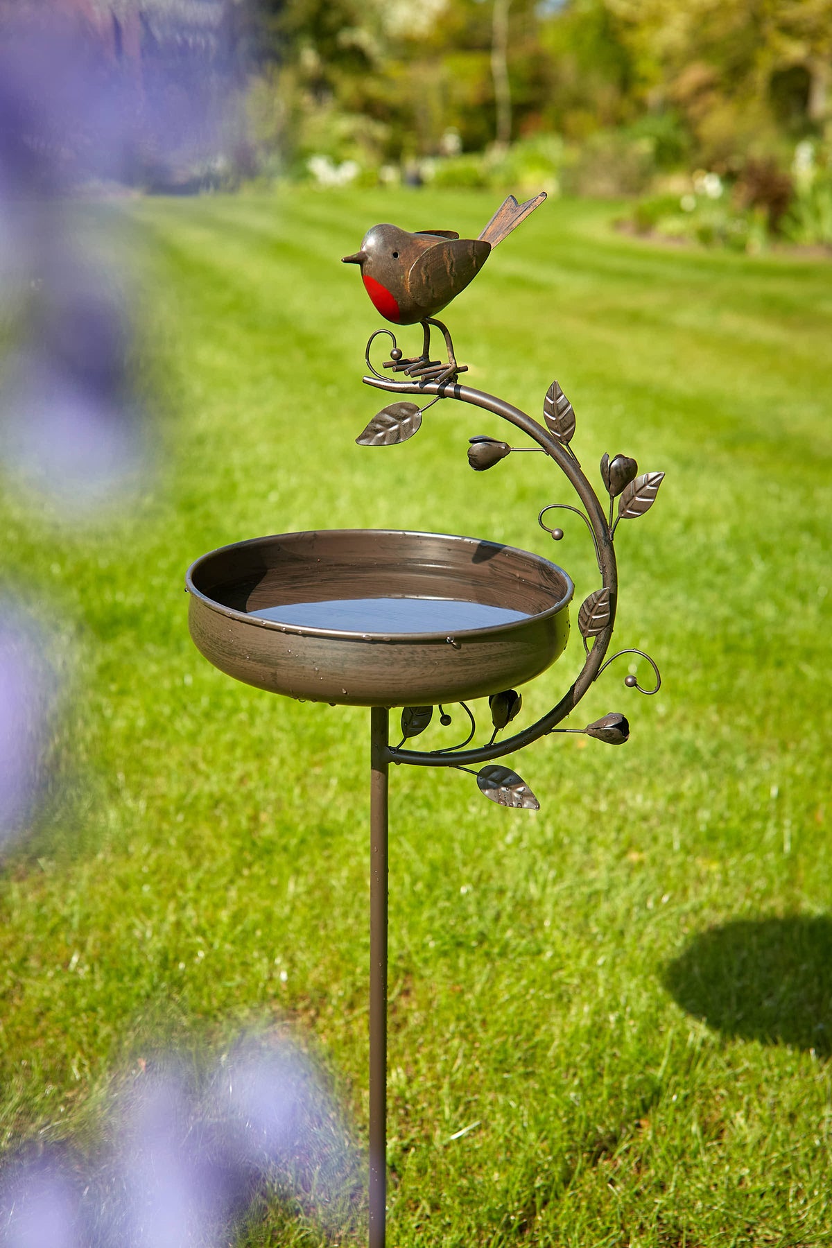 Tom Chambers Robin and Leaf Bird Bath garden stake with a red-breasted robin motif set on a garden lawn.