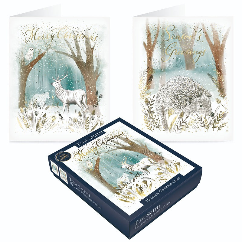 Tom Smith box of 15 luxury woodland scene Christmas cards showing winter forest animals and gold script greetings.