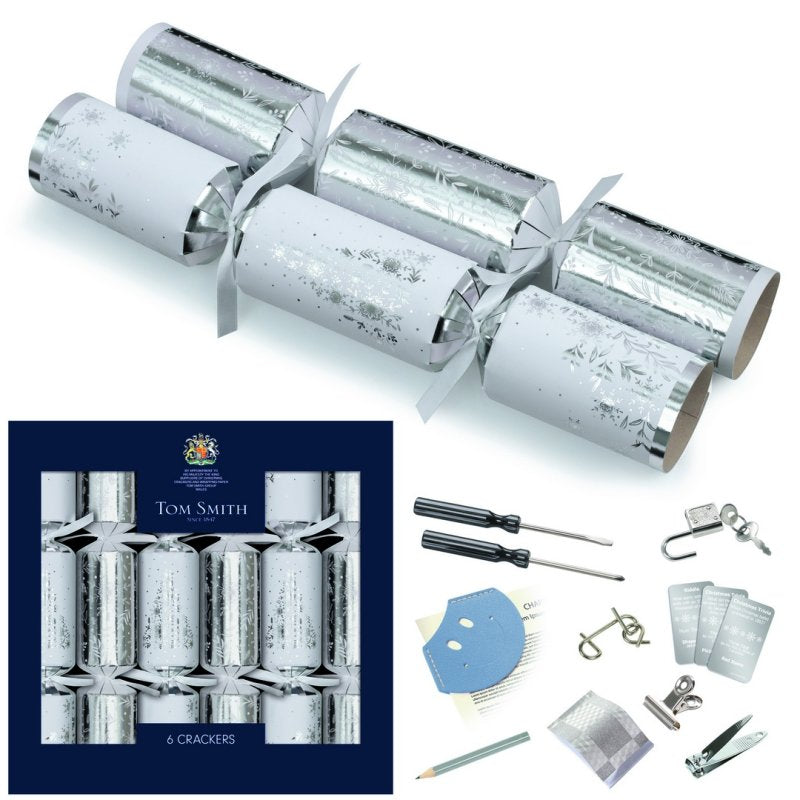 Tom Smith box of 6 silver luxury Christmas crackers with snowflake foil design and included novelty gifts.
