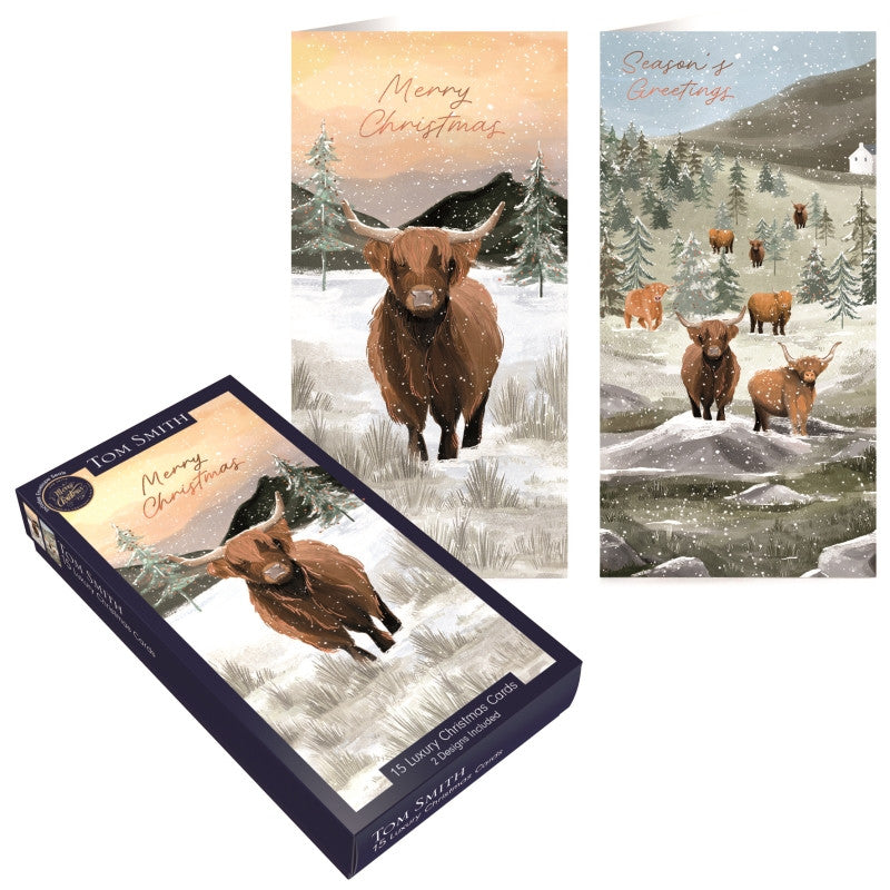 Tom Smith box of 15 slim luxury Highland cow Christmas cards displaying snowy countryside scenes and festive greetings.