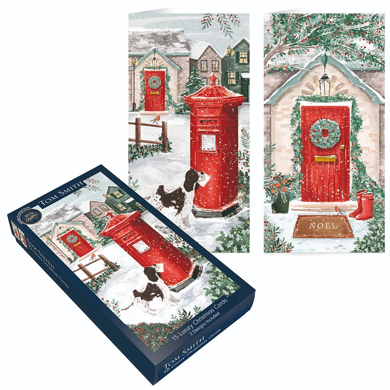 Tom Smith box of 15 slim luxury postbox Christmas cards displaying snowy village scenes and festive decorations.