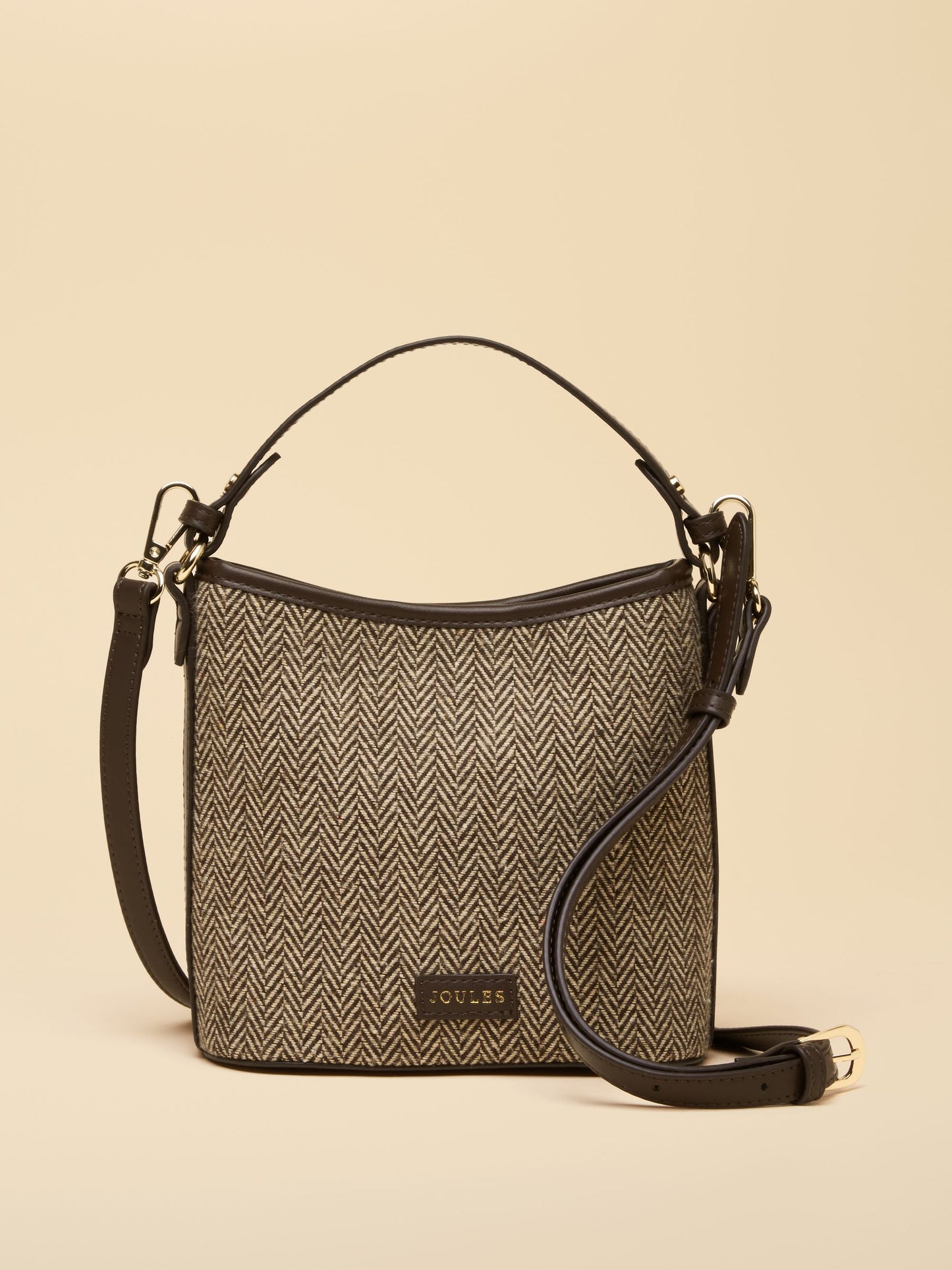 Joules Slouch Bucket Bag in technical weave with smooth faux-leather trim and detachable cross-body strap.