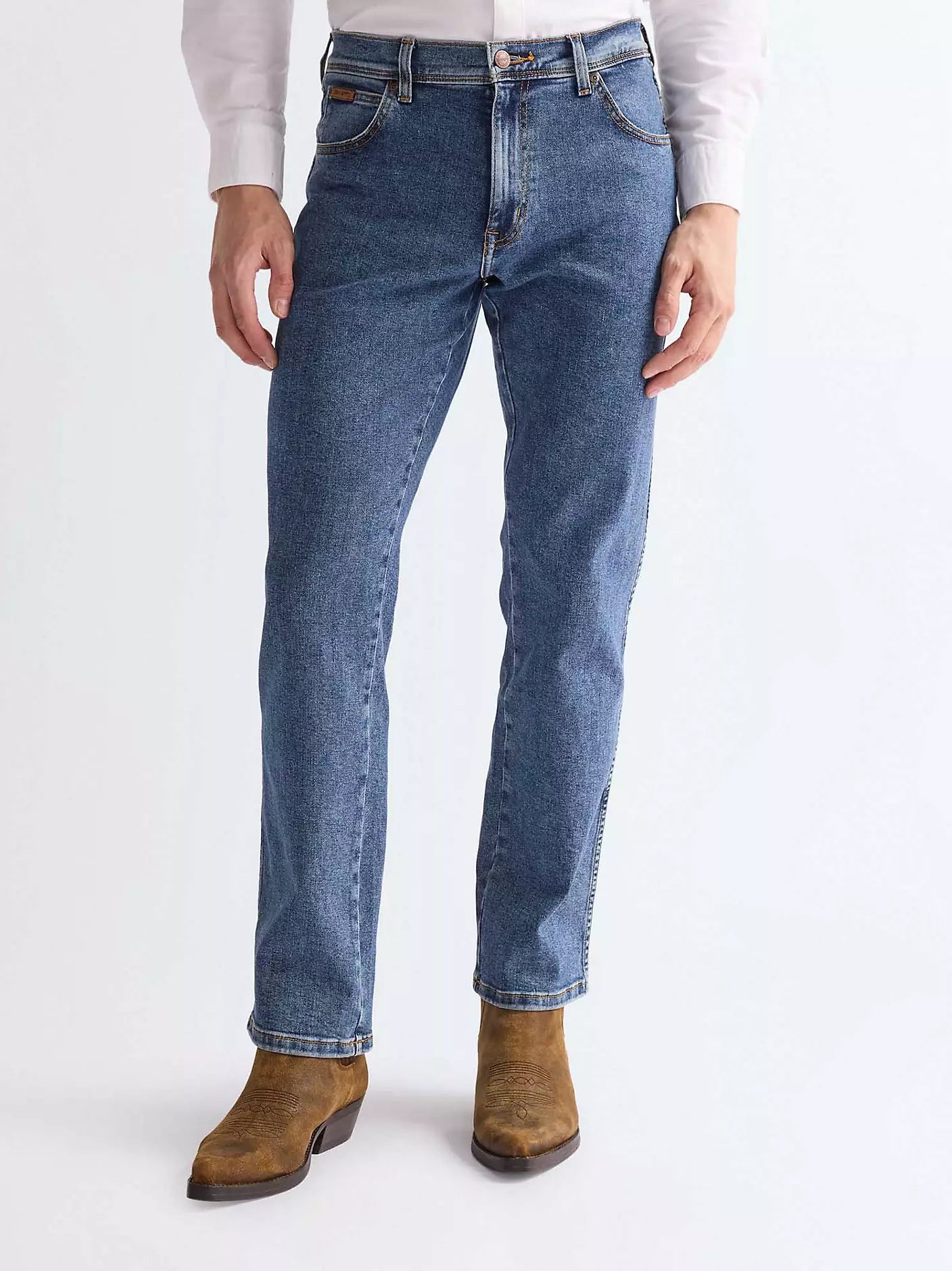 Wrangler Texas Straight Medium Stretch Jeans in stonewash blue featuring copper tone hardware and authentic leather logo patch.