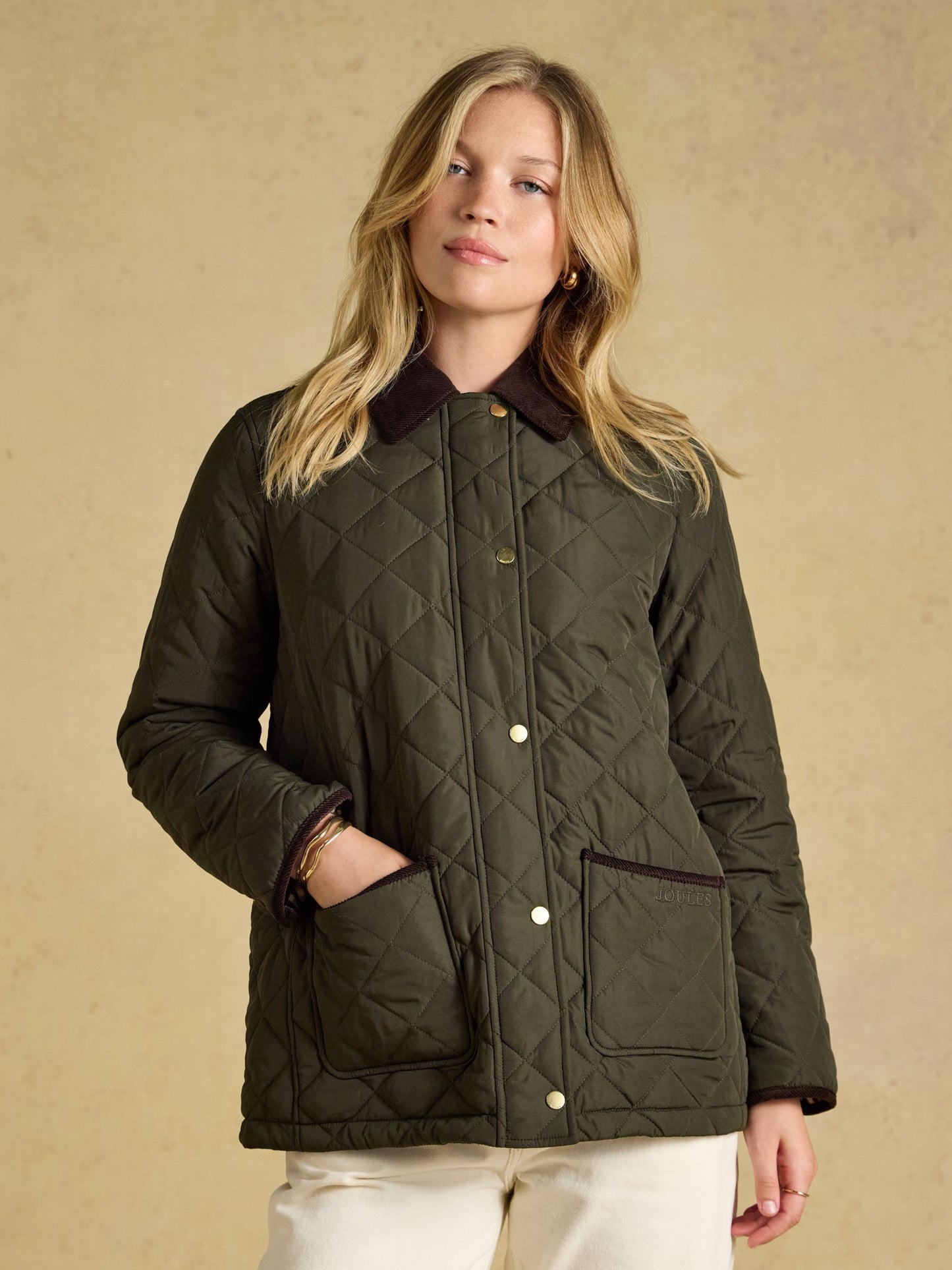 Joules Highgrove Women's Diamond Quilted Jacket featuring soft corduroy collar and deep front patch pockets.