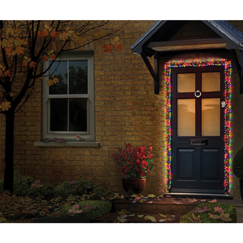 Premier 5.5m cluster garland with 426 LEDs draped around a front door frame glowing brightly