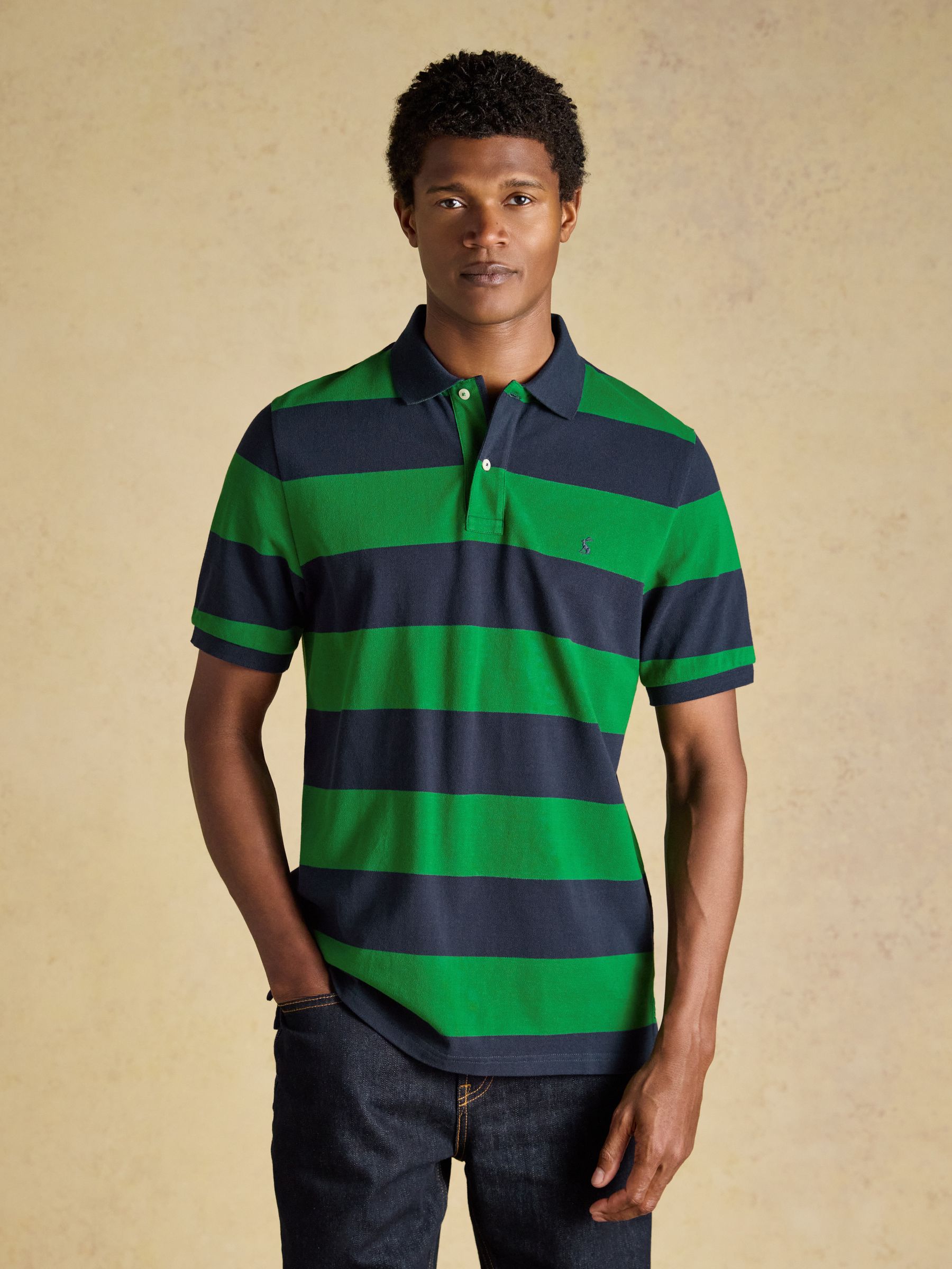 Front view of the Joules Woody Cotton Pique Polo Shirt showing the classic collar, two-button placket, and embroidered hare logo.