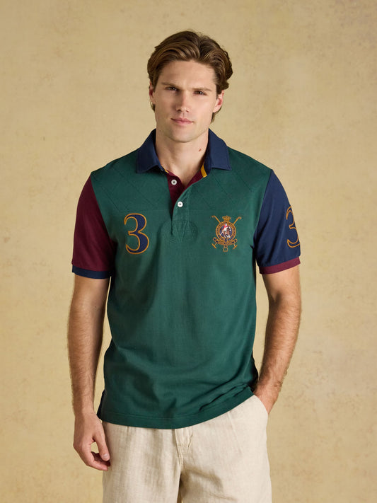 Joules Woody Embellished Cotton Pique Polo Shirt with bold applique detail and ribbed collar.