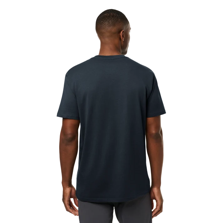 Front and back view of man wearing dark navy YETI short sleeve t-shirt with subtle left chest logo badge