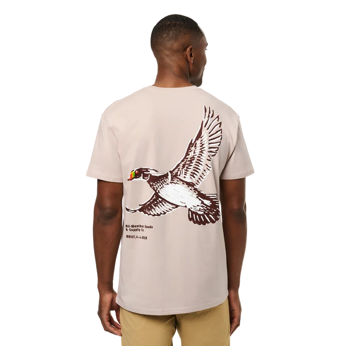 Front and back view of man wearing bone YETI Painted Duck Short Sleeve T-Shirt with flying waterfowl graphic