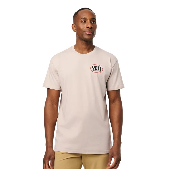 Front and back view of man wearing bone YETI Painted Duck Short Sleeve T-Shirt with flying waterfowl graphic