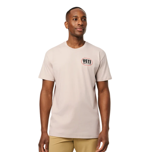 Front and back view of man wearing bone YETI Painted Duck Short Sleeve T-Shirt with flying waterfowl graphic
