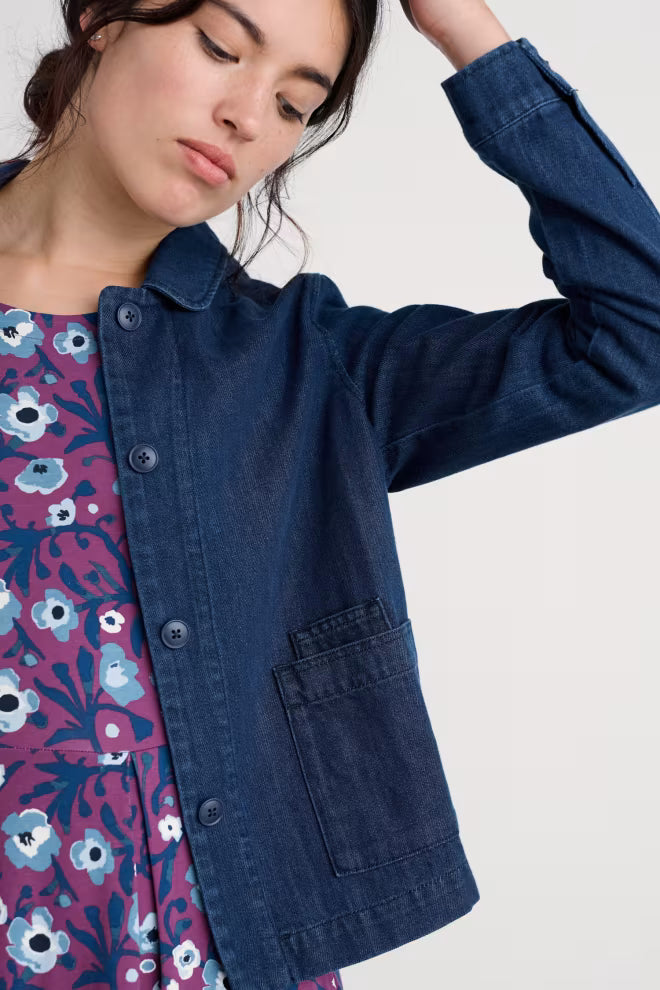 Utility style navy blue Seasalt Cornwall Coombe Lane organic cotton jacket showing the rounded collar, button cuffs, and square patch pockets.