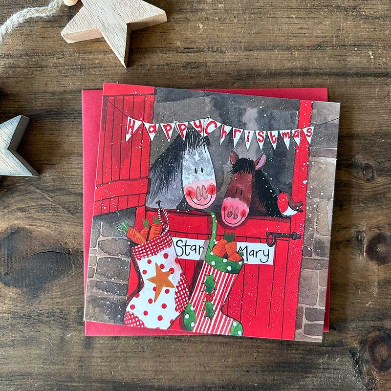 Alex Clark Christmas Stable boxed greeting card set showing illustrated festive farm animal cards and white envelopes in a box.