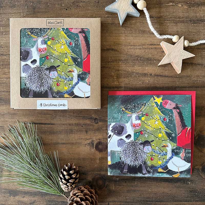 Alex Clark Christmas Tree boxed greeting card set showing illustrated festive tree cards and white envelopes in a box.