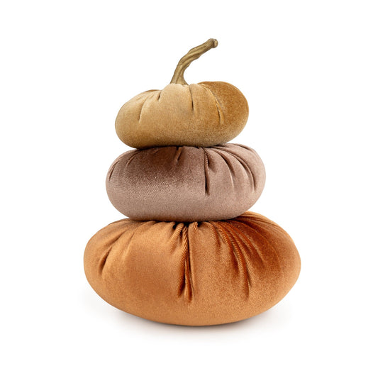 Candlelight trio of stacked velour pumpkin cushions in terracotta hues with a twisted stem