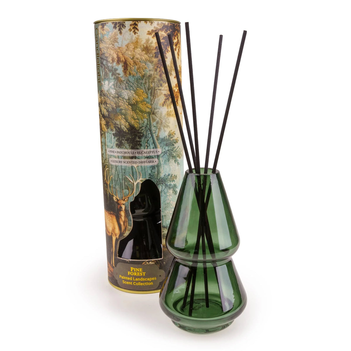 Candlelight Pine Forest 150ml reed diffuser in green glass vessel standing next to stag forest gift tube