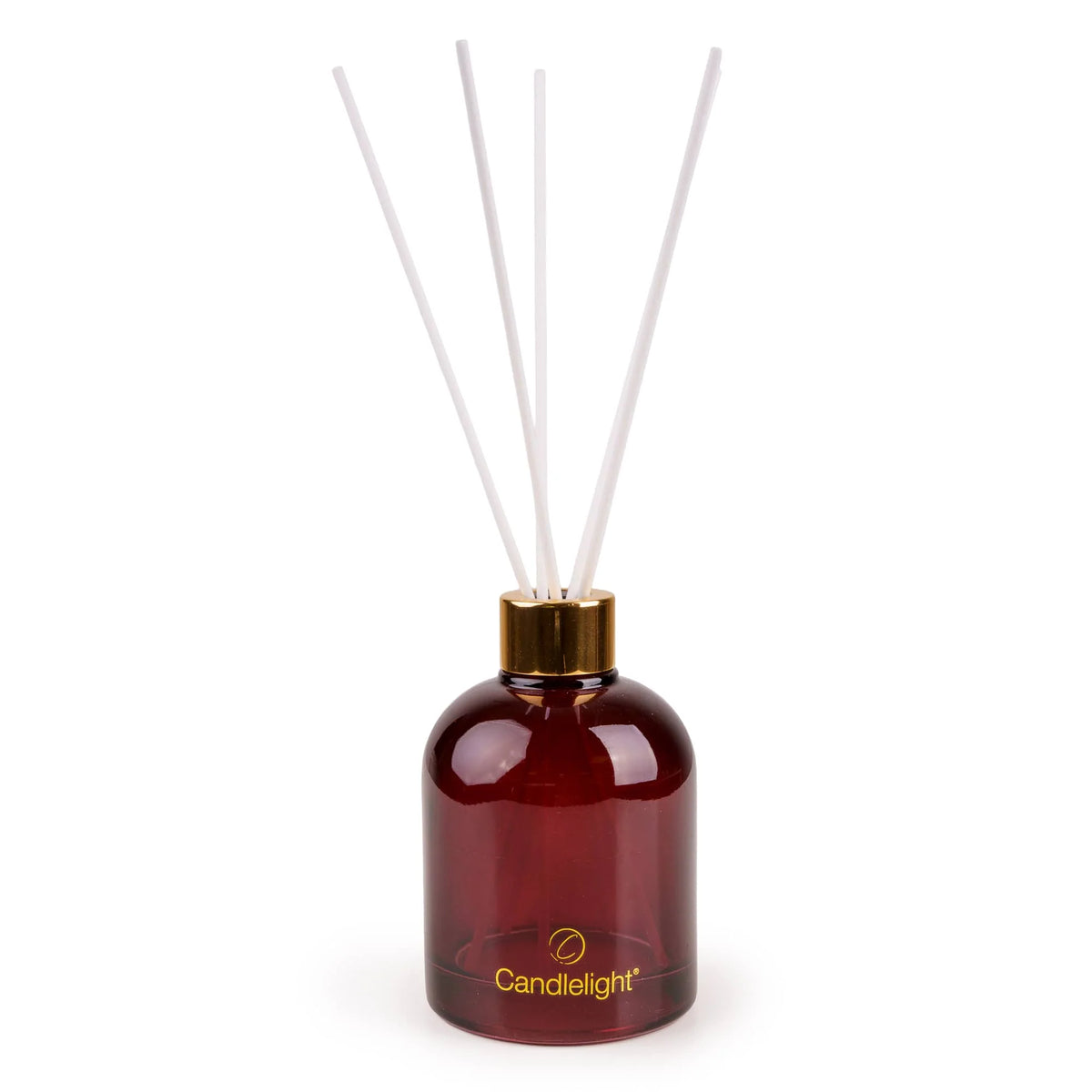Candlelight Red Stockings and Baubles 200ml reed diffuser in red glass bottle beside festive gift box