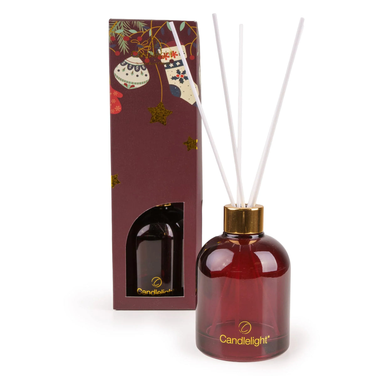 Candlelight Red Stockings and Baubles 200ml reed diffuser in red glass bottle beside festive gift box