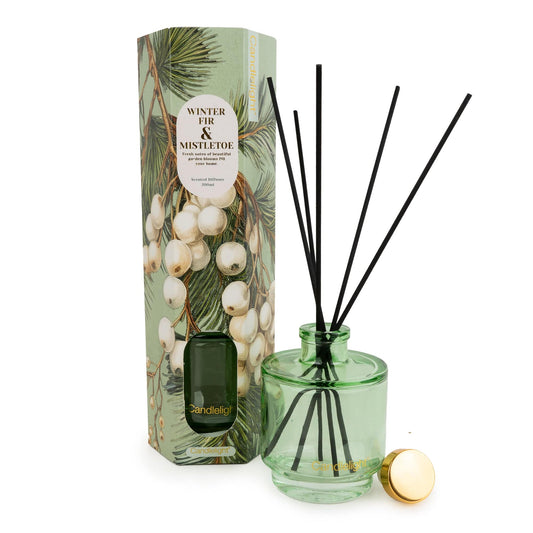 Candlelight Winter Fir and Mistletoe 200ml reed diffuser in green glass bottle beside illustrated gift box