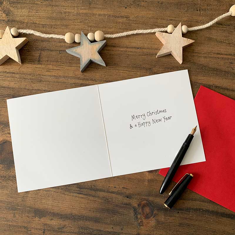 Alex Clark Christmas Bear boxed greeting card set showing illustrated festive bear cards and white envelopes in a box.