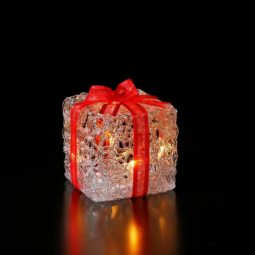 Noma miniature warm white acrylic present Christmas decoration with glowing LED light and sculpted decorative bow
