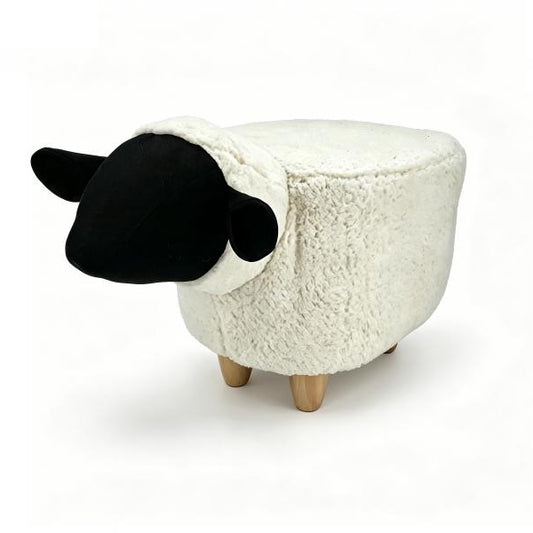Gardeco Snowflake white sheep synthetic fur footstool with black face and four wooden legs.